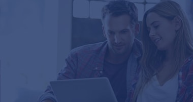 Couple looking at computer together